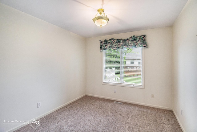 6063 Steeplechase Dr, Grand Blanc, MI 48439 - carpeted empty room featuring baseboards