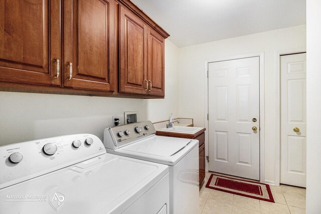 6063 Steeplechase Dr, Grand Blanc, MI 48439 - laundry room with independent washer and dryer, cabinet space, and light tile patterned flooring