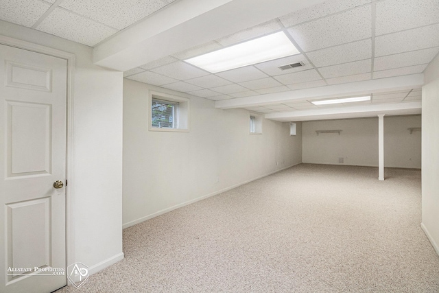 6063 Steeplechase Dr, Grand Blanc, MI 48439 - below grade area with a drop ceiling, carpet floors, and baseboards