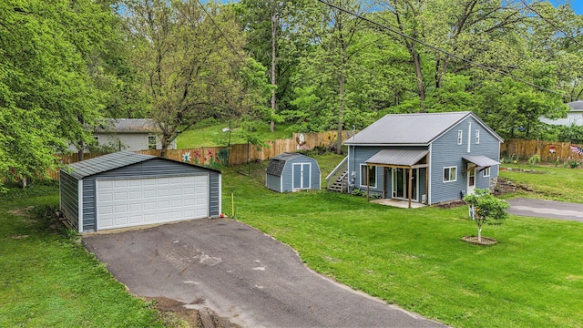 418 W Fargo St, Ionia, MI 48846 - view of yard featuring a detached garage