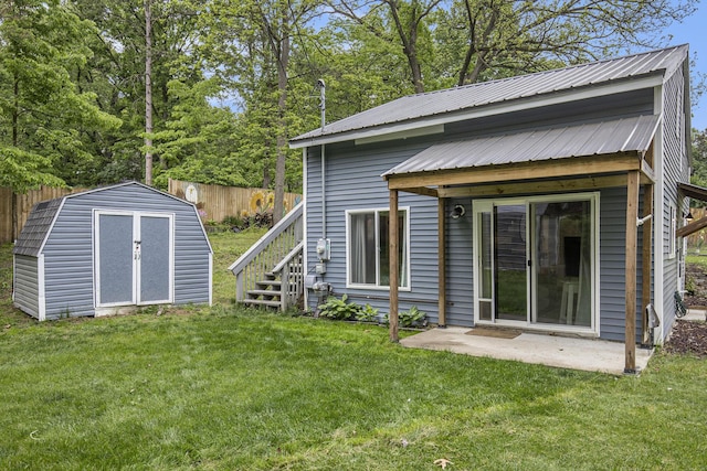 418 W Fargo St, Ionia, MI 48846 - back of house with metal roof, a patio, stairs, and a gambrel roof