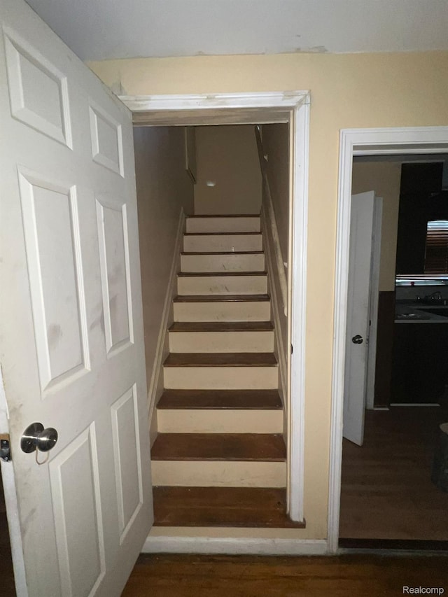 20258 Fairport St, Detroit, MI 48205 - stairs featuring wood finished floors