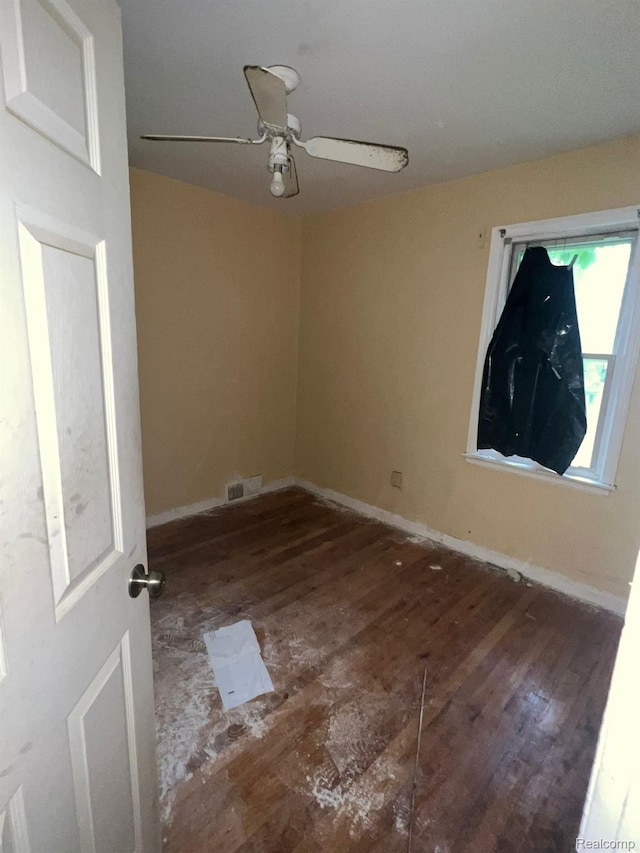 20258 Fairport St, Detroit, MI 48205 - unfurnished room featuring wood finished floors, ceiling fan, and baseboards