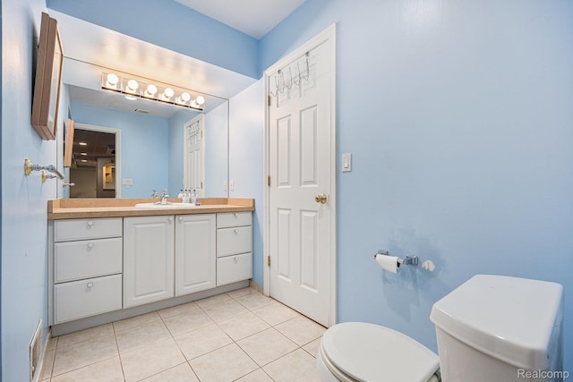 785 River Bend Dr, Rochester Hills, MI 48307 - bathroom featuring toilet, vanity, tile patterned flooring, and baseboards