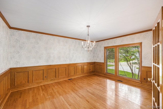 785 River Bend Dr, Rochester Hills, MI 48307 - spare room with light wood-type flooring, a wainscoted wall, a chandelier, and ornamental molding