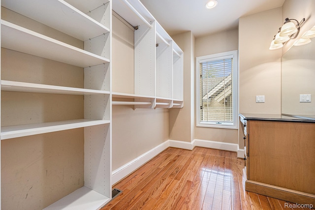 785 River Bend Dr, Rochester Hills, MI 48307 - walk in closet featuring light wood-type flooring