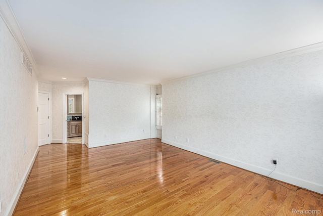785 River Bend Dr, Rochester Hills, MI 48307 - empty room with crown molding, light wood-style floors, and baseboards