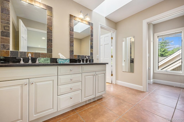 785 River Bend Dr, Rochester Hills, MI 48307 - full bath with double vanity, tile patterned flooring, and baseboards