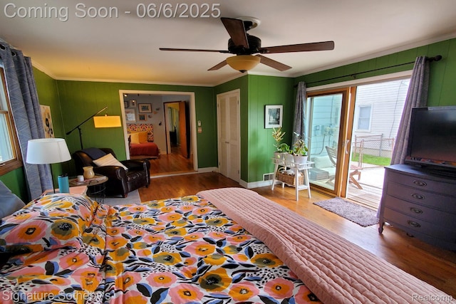 917 N Edison Ave, Royal Oak, MI 48067 - bedroom with access to outside, ornamental molding, wood finished floors, a ceiling fan, and wood walls