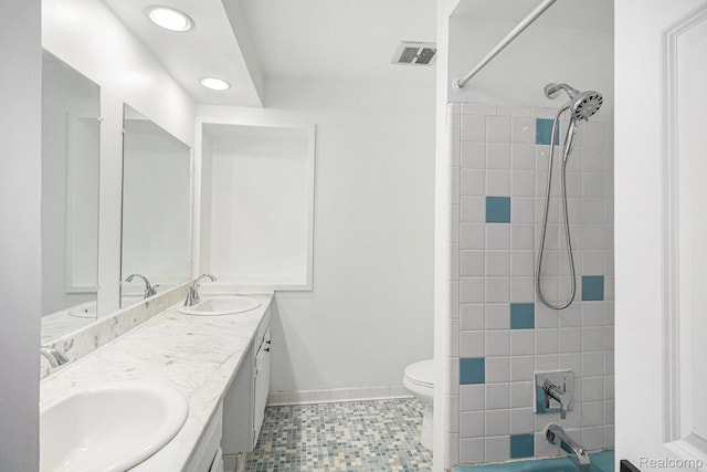 429 Bella Vis, Grand Blanc, MI 48439 - full bathroom featuring double vanity, toilet, shower / tub combination, recessed lighting, and baseboards
