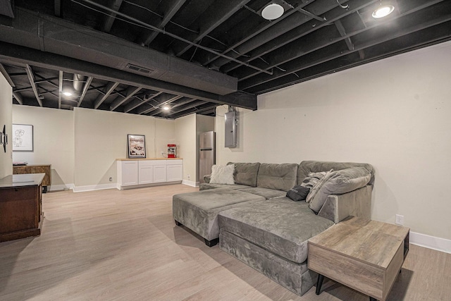 3360 Brook Trl SE, Grand Rapids, MI 49508 - living area with electric panel, light wood-type flooring, and baseboards