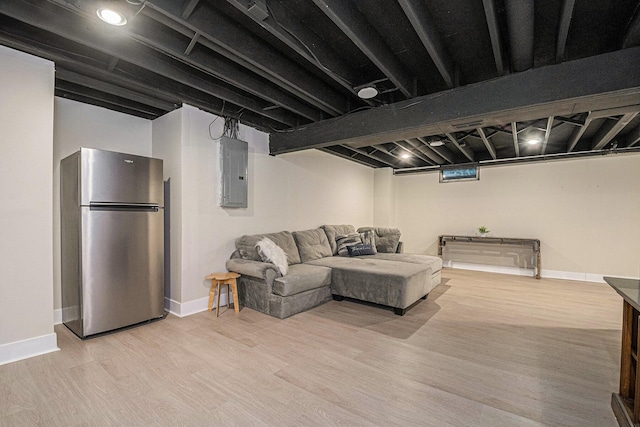 3360 Brook Trl SE, Grand Rapids, MI 49508 - living room featuring electric panel, light wood-style flooring, and baseboards