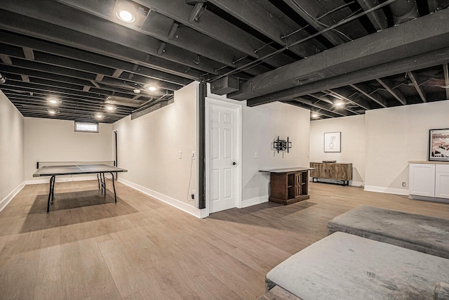 3360 Brook Trl SE, Grand Rapids, MI 49508 - rec room with wood finished floors and baseboards