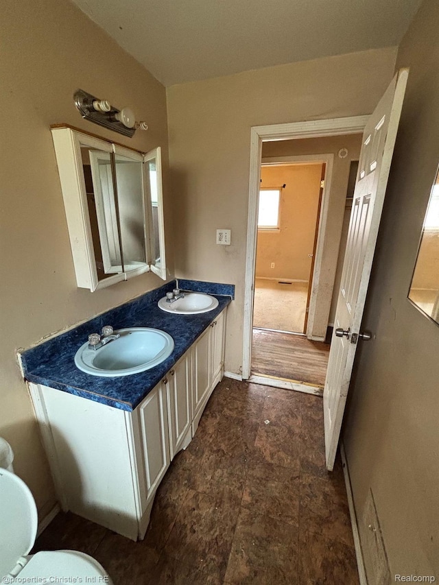 19627 Algonac St, Detroit, MI 48234 - bathroom featuring double vanity and toilet