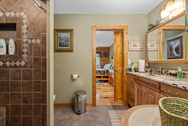 376 Highview Rd, Traverse City, MI 49696 - ensuite bathroom with vanity, tile patterned floors, baseboards, and toilet