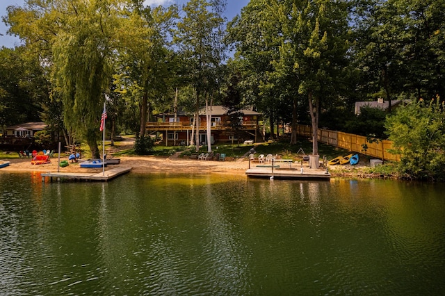 376 Highview Rd, Traverse City, MI 49696 - dock area with a deck with water view and view of scattered trees