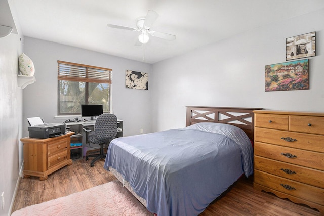 608 N Wickshire Ln, Durand, MI 48429 - bedroom with wood finished floors, an office area, and a ceiling fan