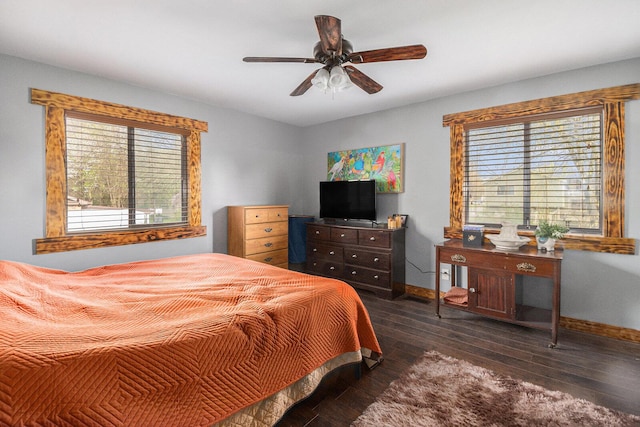 608 N Wickshire Ln, Durand, MI 48429 - bedroom with baseboards, multiple windows, hardwood / wood-style flooring, and a ceiling fan