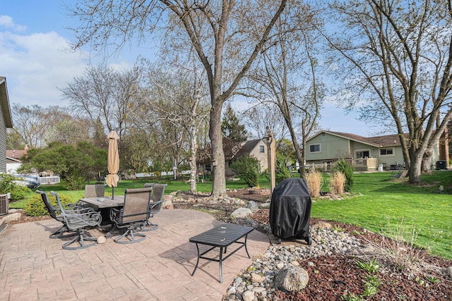 608 N Wickshire Ln, Durand, MI 48429 - view of patio featuring a grill, outdoor dining area, and central AC unit