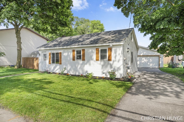 180 Maple St, Sparta, MI 49345 - view of front of property featuring a shingled roof, an outdoor structure, and a garage