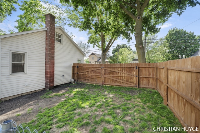 180 Maple St, Sparta, MI 49345 - view of yard featuring a gate