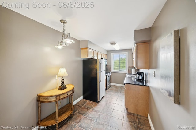307 N Eton St, Birmingham, MI 48009 - kitchen featuring appliances with stainless steel finishes, dark countertops, baseboards, a sink, and tile patterned flooring