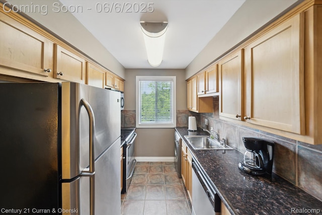 307 N Eton St, Birmingham, MI 48009 - kitchen featuring appliances with stainless steel finishes, a sink, backsplash, light brown cabinetry, and tile patterned floors