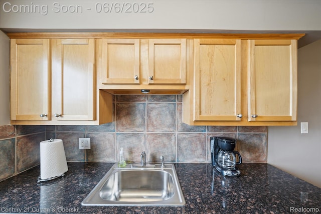 307 N Eton St, Birmingham, MI 48009 - kitchen with light brown cabinets, a sink, decorative backsplash, and dark stone counters