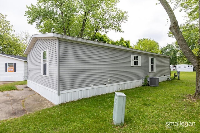 229 Spear St SW, Grand Rapids, MI 49548 - view of side of property featuring a yard and cooling unit