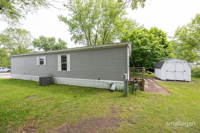 229 Spear St SW, Grand Rapids, MI 49548 - back of house with central AC and a yard