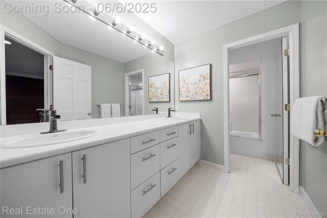 6212 Bromley Ct, West Bloomfield, MI 48322 - bathroom with double vanity, baseboards, tile patterned flooring, and shower / bath combination with glass door