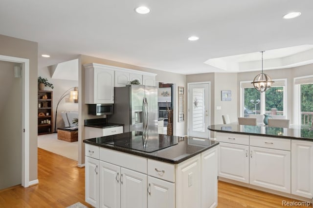 3468 High Hillcrest Dr, Howell, MI 48843 - kitchen with appliances with stainless steel finishes, a chandelier, light wood-style floors, a center island, and recessed lighting