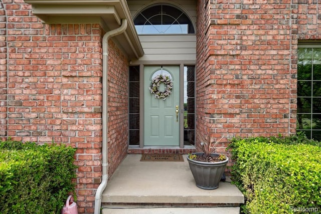 3468 High Hillcrest Dr, Howell, MI 48843 - property entrance featuring brick siding