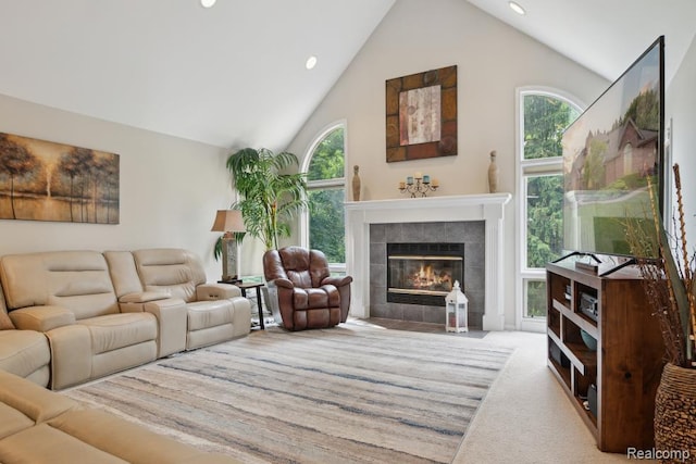 3468 High Hillcrest Dr, Howell, MI 48843 - carpeted living area featuring a fireplace, plenty of natural light, recessed lighting, and high vaulted ceiling
