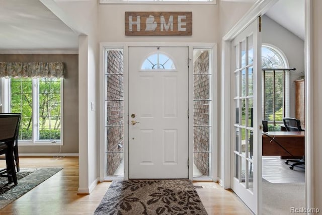 3468 High Hillcrest Dr, Howell, MI 48843 - foyer entrance featuring healthy amount of natural light, wood finished floors, and baseboards
