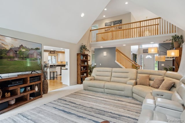 3468 High Hillcrest Dr, Howell, MI 48843 - living room featuring high vaulted ceiling, recessed lighting, stairs, and light colored carpet