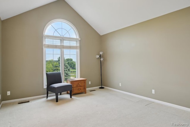 3468 High Hillcrest Dr, Howell, MI 48843 - sitting room with light colored carpet, lofted ceiling, and baseboards