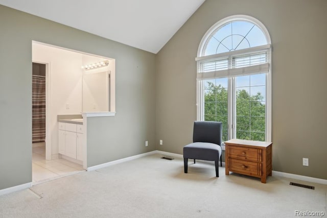 3468 High Hillcrest Dr, Howell, MI 48843 - sitting room with light colored carpet, baseboards, and high vaulted ceiling