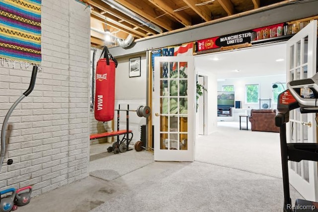 3468 High Hillcrest Dr, Howell, MI 48843 - basement with brick wall and french doors