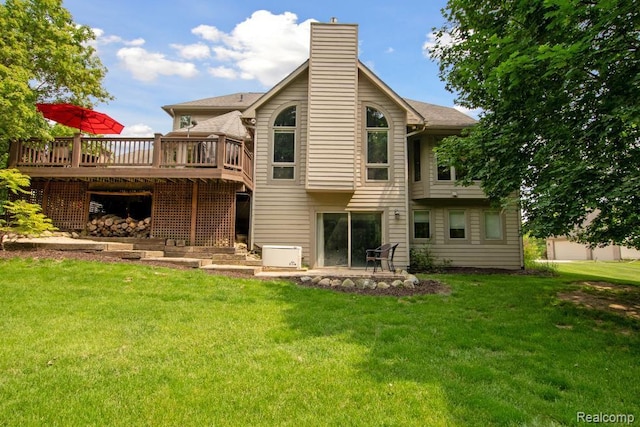 3468 High Hillcrest Dr, Howell, MI 48843 - back of house with a deck, a yard, and a chimney