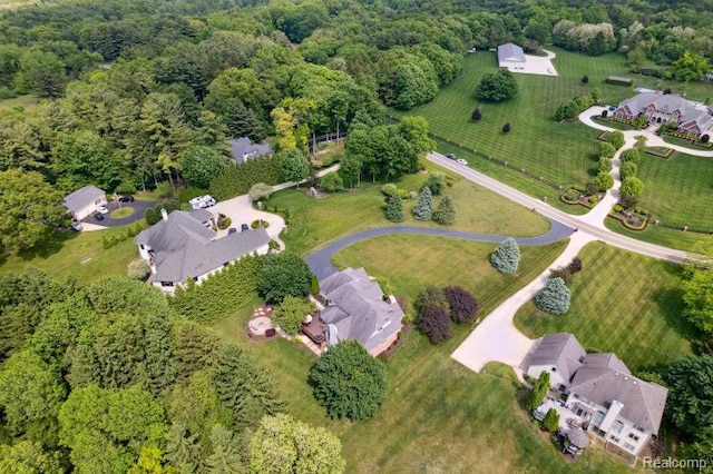 3468 High Hillcrest Dr, Howell, MI 48843 - aerial view of property's location featuring a heavily wooded area