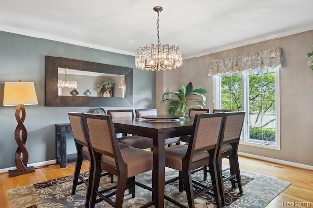 3468 High Hillcrest Dr, Howell, MI 48843 - dining room featuring a chandelier, light wood finished floors, baseboards, and crown molding
