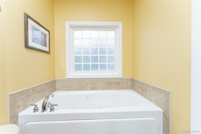 1235 Joann Ln, Williamston, MI 48895 - full bathroom featuring a tub with jets and toilet