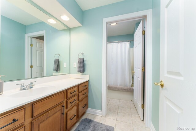 1235 Joann Ln, Williamston, MI 48895 - full bath with vanity, tile patterned floors, and baseboards