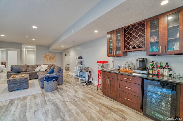 1235 Joann Ln, Williamston, MI 48895 - indoor wet bar with wine cooler, recessed lighting, baseboards, and light wood-type flooring