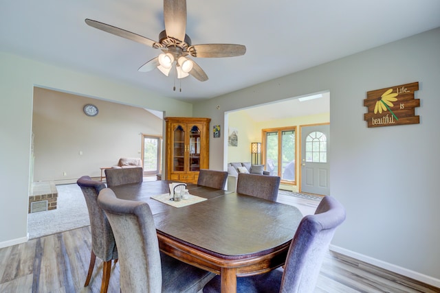 4470 Peach Ridge Ave NW, Grand Rapids, MI 49544 - dining area featuring healthy amount of natural light, wood finished floors, a ceiling fan, and baseboards