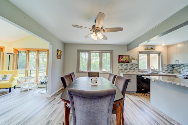 4470 Peach Ridge Ave NW, Grand Rapids, MI 49544 - dining space with light wood-style floors, ceiling fan, and baseboards