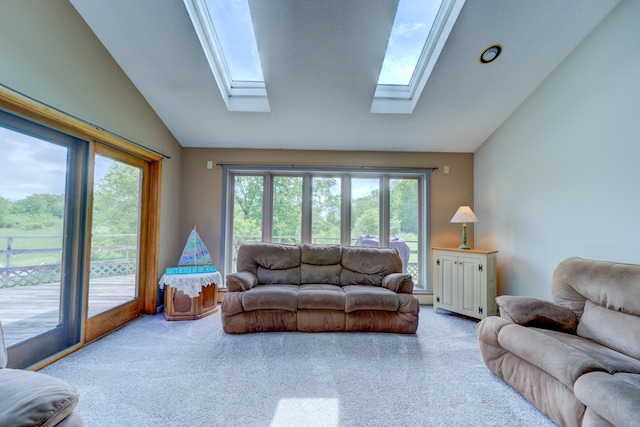 4470 Peach Ridge Ave NW, Grand Rapids, MI 49544 - carpeted living room featuring lofted ceiling and a skylight