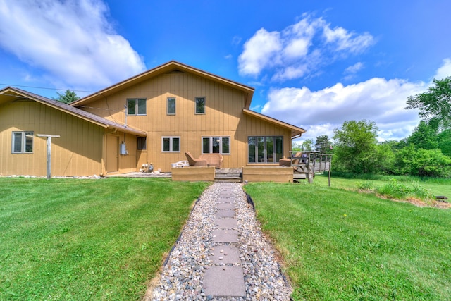 4470 Peach Ridge Ave NW, Grand Rapids, MI 49544 - rear view of property featuring a yard and a deck