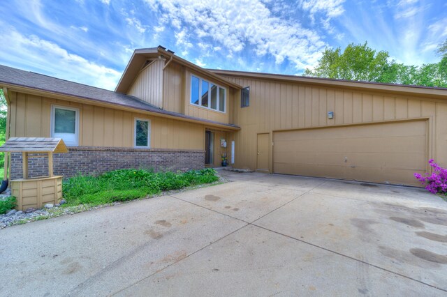 4470 Peach Ridge Ave NW, Grand Rapids, MI 49544 - view of front of property with brick siding, concrete driveway, and an attached garage